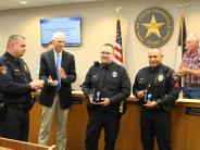 Ofc. Lanier and Sgt. Gaitan recieve a life saving award from the council