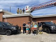 The girl scounts deliver cookies to police and fire personnel 